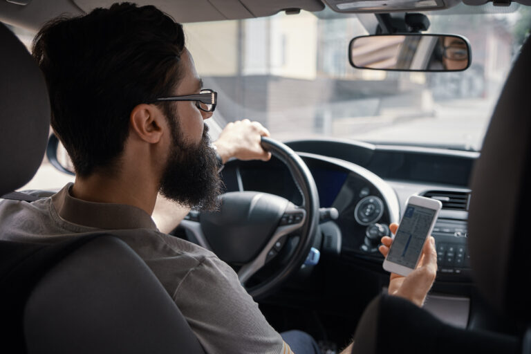 Man using mobile phone while driving